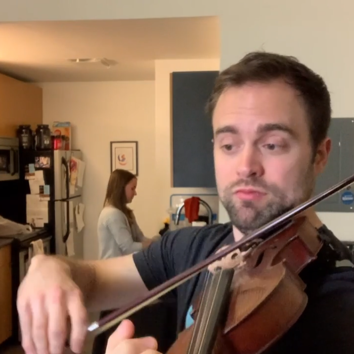 Violinist Robert Espe plays for 20 seconds to demonstrate proper handwashing technique